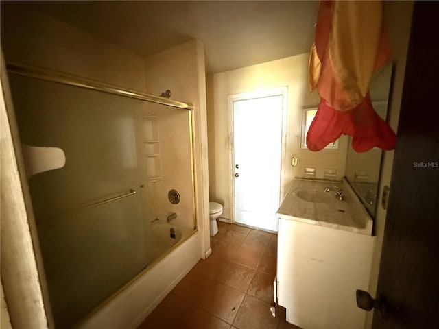 9722 Kenton Rd, Wesley Chapel, FL 33545 - bathroom featuring toilet, tile patterned floors, vanity, and shower / washtub combination