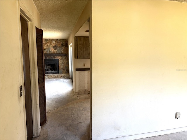 9722 Kenton Rd, Wesley Chapel, FL 33545 - hallway with a textured ceiling and unfinished concrete flooring