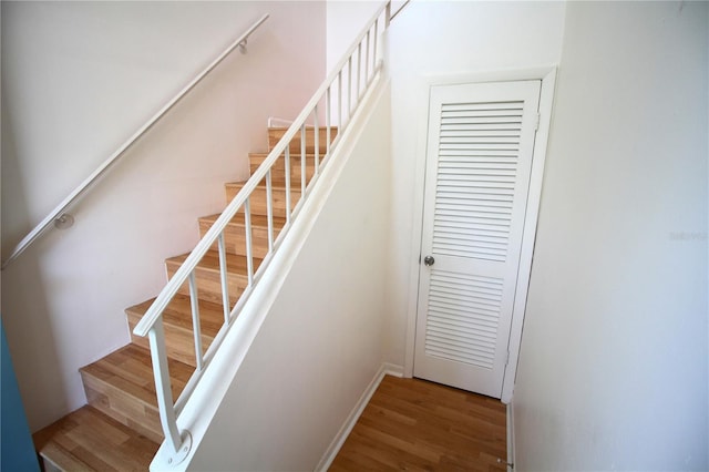 staircase with wood finished floors