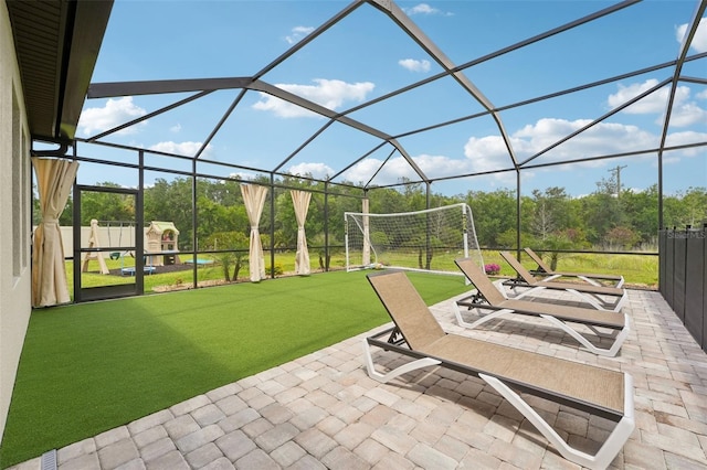 view of patio / terrace featuring glass enclosure