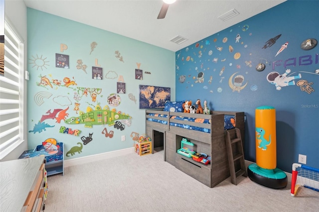carpeted bedroom with a ceiling fan and baseboards