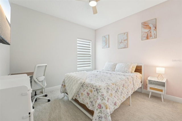 bedroom featuring carpet, baseboards, and a ceiling fan