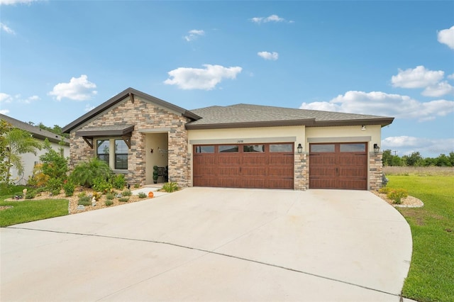 view of front of house featuring stone siding, an attached garage, concrete driveway, and a front lawn