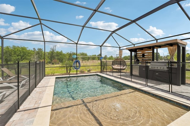 swimming pool featuring a patio, exterior kitchen, a lanai, and a grill