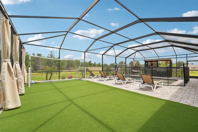 view of patio / terrace featuring glass enclosure