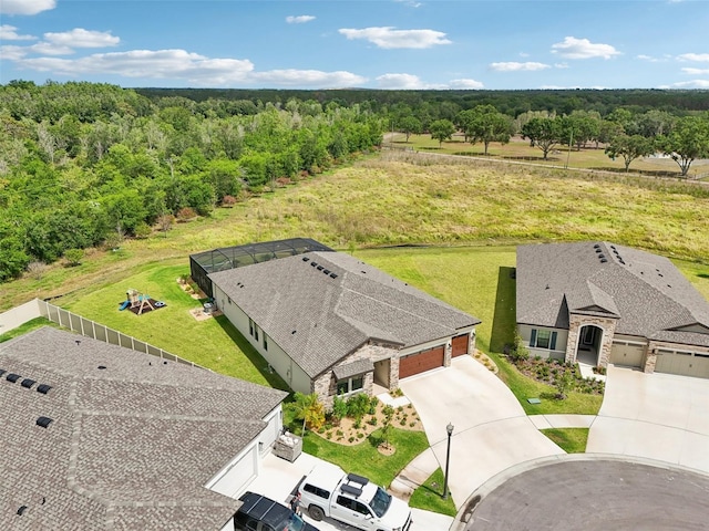view of subject property with a heavily wooded area