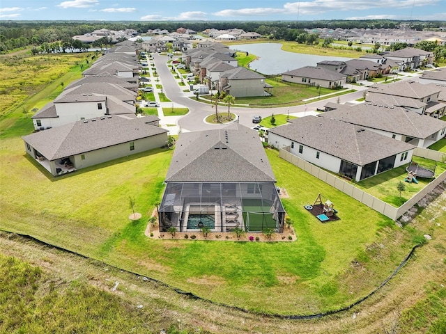 aerial perspective of suburban area featuring a nearby body of water