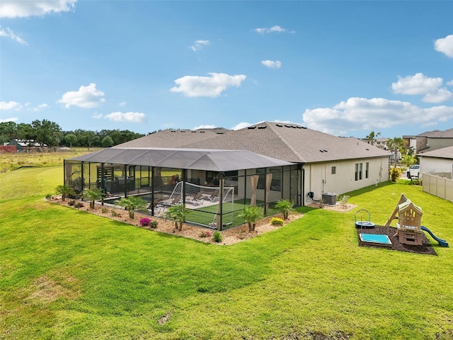 back of house featuring a yard, a lanai, and cooling unit