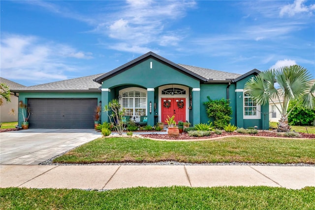 5103 Rushbrook Rd, Land O Lakes, FL 34638 - single story home with stucco siding, an attached garage, a front lawn, concrete driveway, and roof with shingles