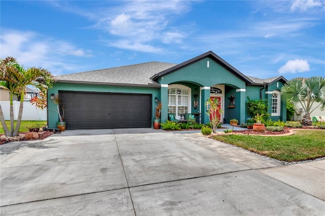 5103 Rushbrook Rd, Land O Lakes, FL 34638 - ranch-style house featuring stucco siding, an attached garage, concrete driveway, and a front lawn