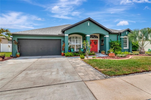 5103 Rushbrook Rd, Land O Lakes, FL 34638 - single story home with stucco siding, an attached garage, a front yard, and concrete driveway