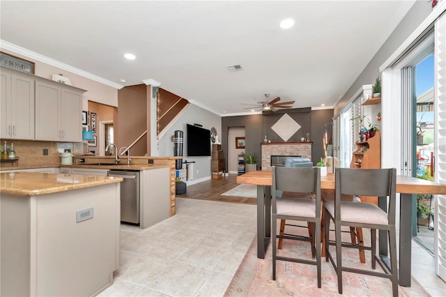 5103 Rushbrook Rd, Land O Lakes, FL 34638 - kitchen featuring stainless steel dishwasher, a peninsula, ceiling fan, a sink, and recessed lighting