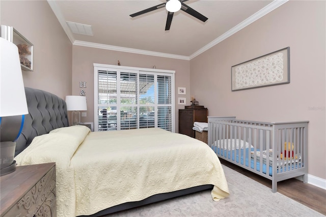 5103 Rushbrook Rd, Land O Lakes, FL 34638 - bedroom featuring ornamental molding, wood finished floors, ceiling fan, and baseboards