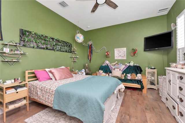 5103 Rushbrook Rd, Land O Lakes, FL 34638 - bedroom with wood finished floors and a ceiling fan