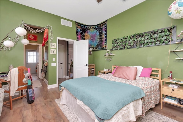 5103 Rushbrook Rd, Land O Lakes, FL 34638 - bedroom featuring wood finished floors and baseboards