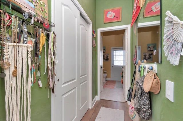 5103 Rushbrook Rd, Land O Lakes, FL 34638 - corridor featuring baseboards and wood finished floors