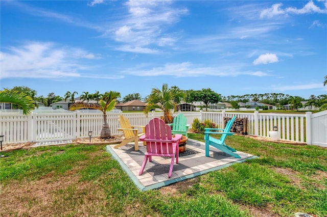 5103 Rushbrook Rd, Land O Lakes, FL 34638 - view of yard featuring a patio and an outdoor fire pit