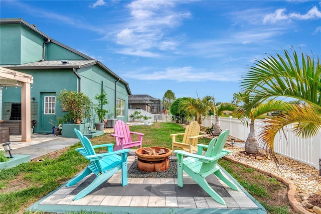 5103 Rushbrook Rd, Land O Lakes, FL 34638 - view of patio featuring an outdoor fire pit and a fenced backyard