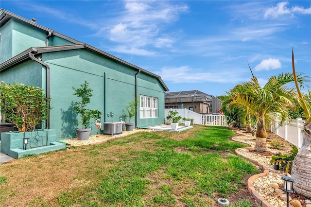 5103 Rushbrook Rd, Land O Lakes, FL 34638 - view of side of property with central AC unit and stucco siding