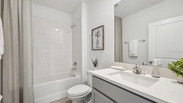 full bathroom with toilet, shower / bath combo, and vanity
