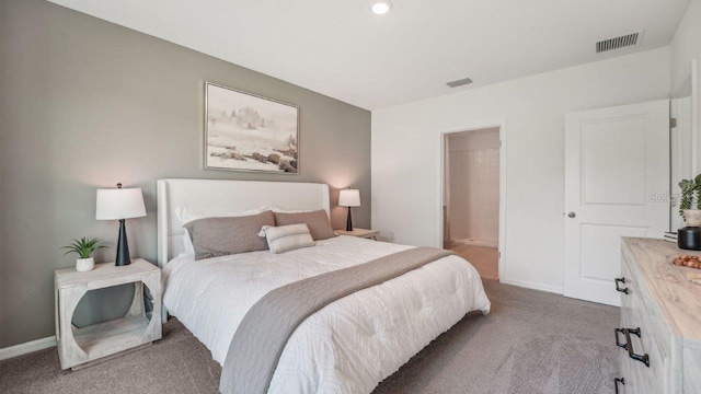 bedroom featuring carpet floors and baseboards