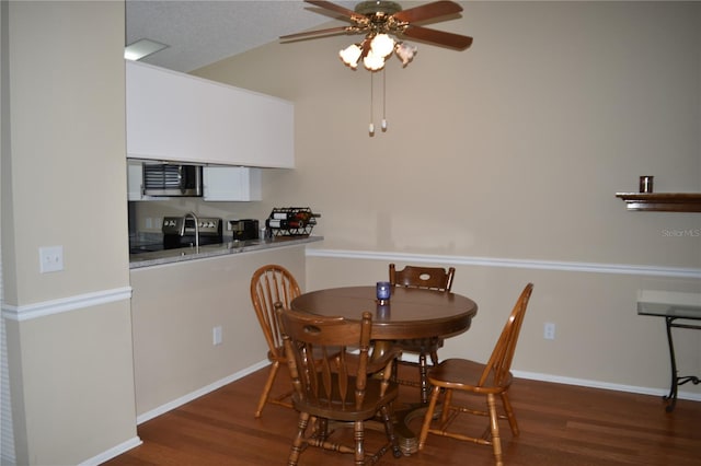 dining area featuring ceiling fan, wood finished floors, and baseboards