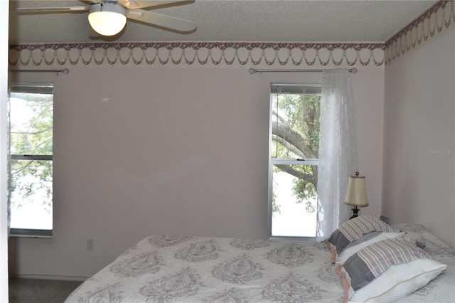 carpeted bedroom featuring a ceiling fan