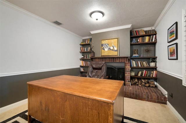 office space with a textured ceiling, crown molding, carpet floors, and baseboards