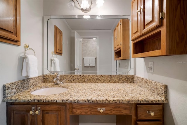bathroom with vanity and crown molding