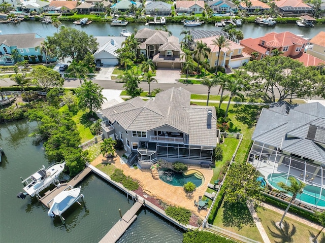 aerial perspective of suburban area with a nearby body of water