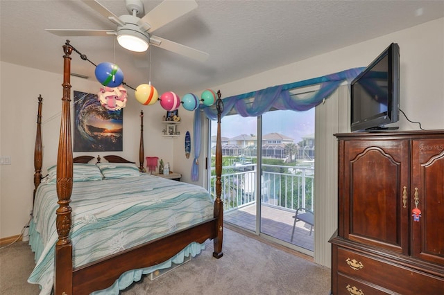 bedroom with carpet flooring, access to outside, and a ceiling fan