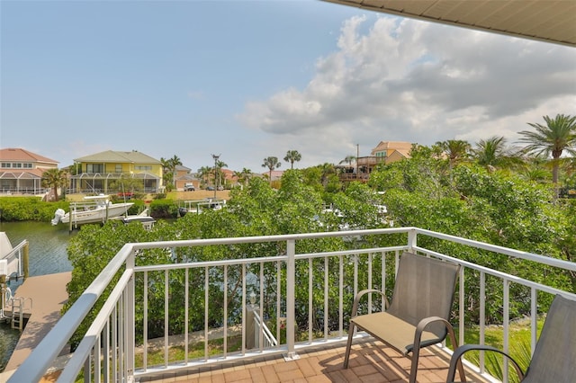 balcony with a water view and a residential view