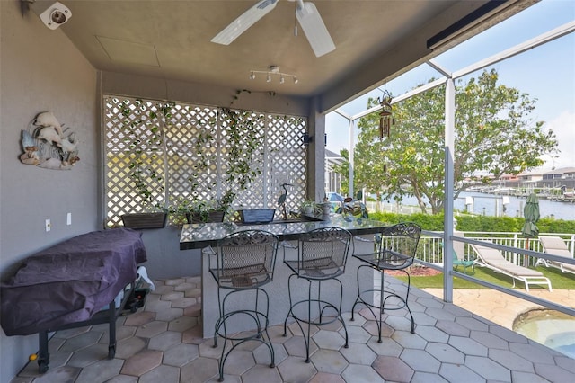 view of patio featuring ceiling fan