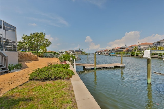 dock area featuring a water view and a residential view