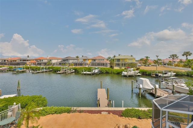 dock area with a residential view and a water view
