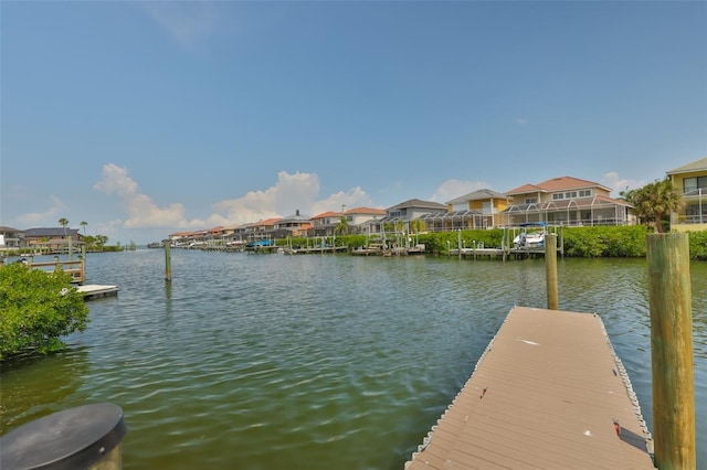 dock with a water view and a residential view