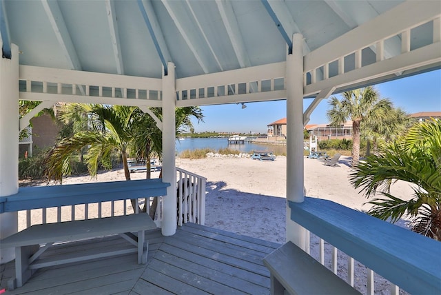 wooden deck with a water view