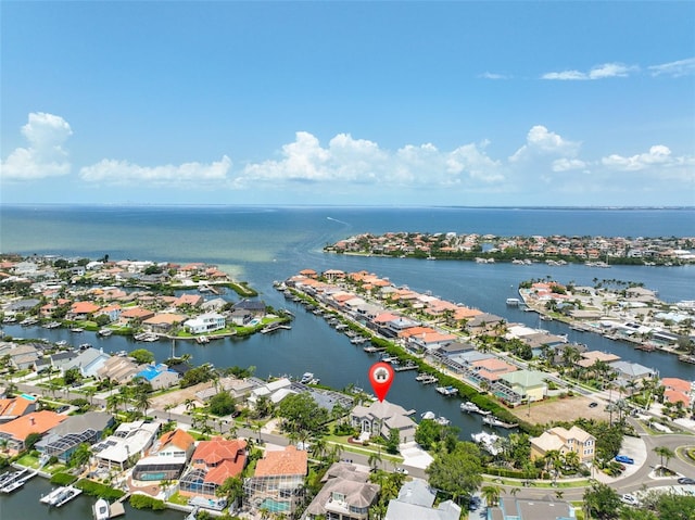 aerial view of residential area featuring a large body of water