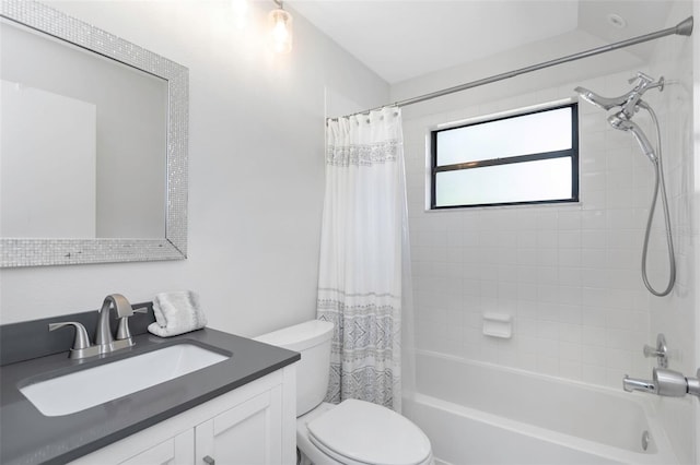 bathroom with toilet, shower / tub combo, and vanity
