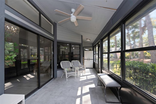sunroom / solarium featuring lofted ceiling and ceiling fan