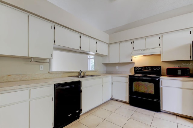 8110 Pond Shadow Ln, Tampa, FL 33635 - kitchen with black appliances, under cabinet range hood, a sink, and light countertops