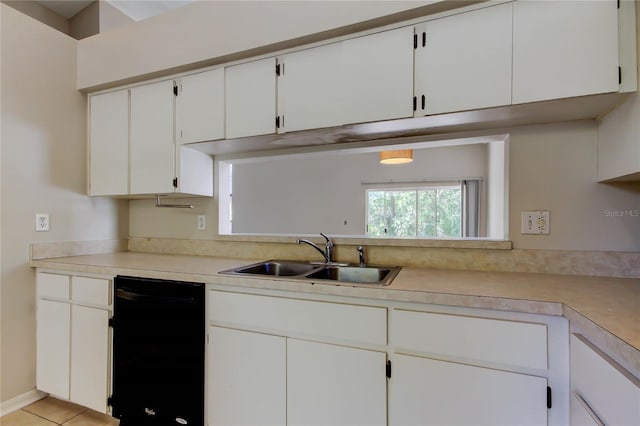 8110 Pond Shadow Ln, Tampa, FL 33635 - kitchen featuring dishwasher, a sink, light countertops, and white cabinetry