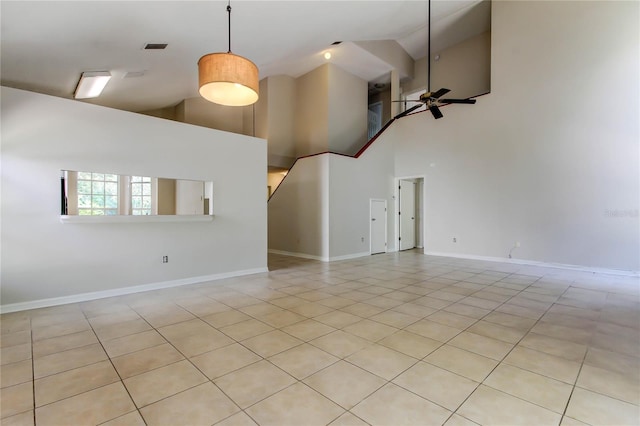 8110 Pond Shadow Ln, Tampa, FL 33635 - unfurnished living room with high vaulted ceiling, a ceiling fan, light tile patterned flooring, and baseboards