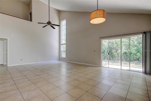 8110 Pond Shadow Ln, Tampa, FL 33635 - spare room with high vaulted ceiling, baseboards, plenty of natural light, ceiling fan, and light tile patterned floors