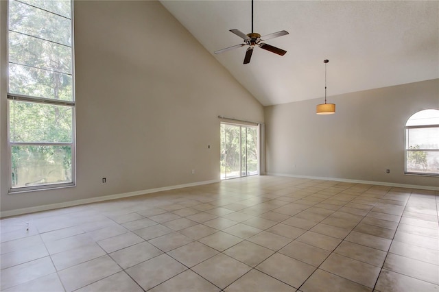 8110 Pond Shadow Ln, Tampa, FL 33635 - unfurnished room with high vaulted ceiling, light tile patterned floors, a ceiling fan, and baseboards