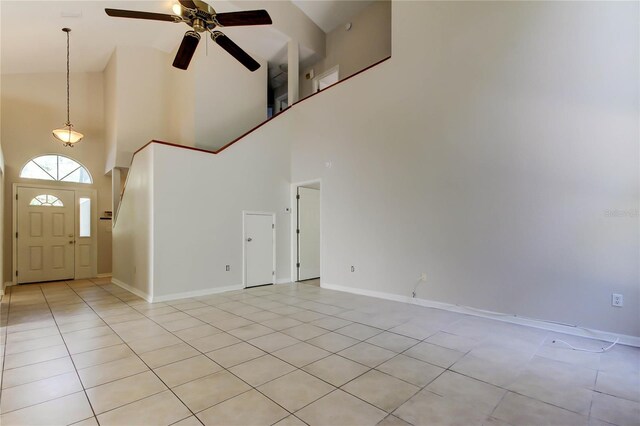 8110 Pond Shadow Ln, Tampa, FL 33635 - foyer entrance featuring high vaulted ceiling, light tile patterned floors, a ceiling fan, and baseboards