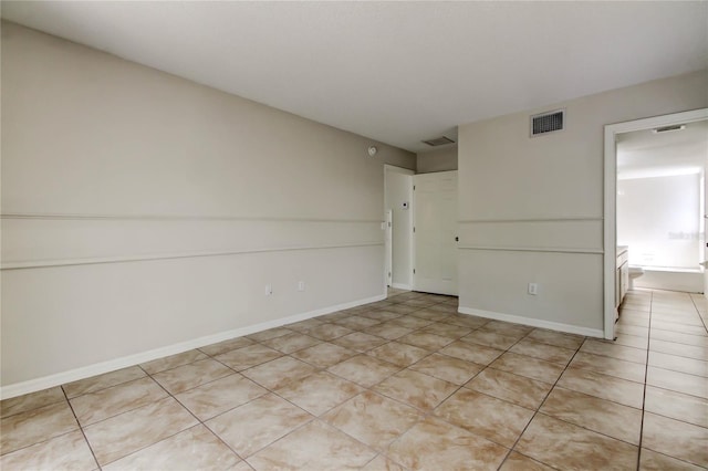 8110 Pond Shadow Ln, Tampa, FL 33635 - spare room with light tile patterned floors and baseboards