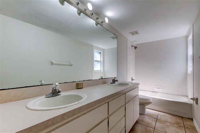 8110 Pond Shadow Ln, Tampa, FL 33635 - bathroom featuring toilet, double vanity, tile patterned floors, and shower / bathtub combination