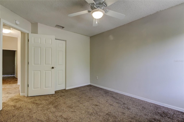 8110 Pond Shadow Ln, Tampa, FL 33635 - unfurnished bedroom featuring carpet floors, a textured ceiling, a ceiling fan, and baseboards