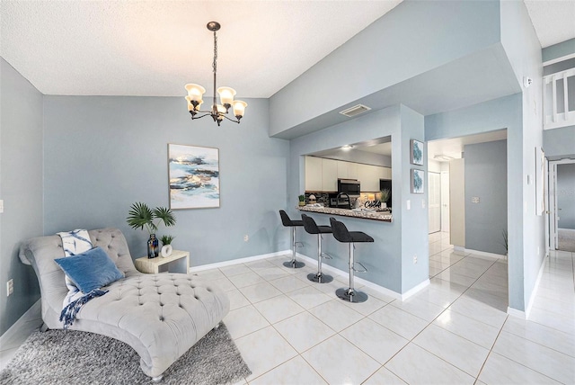 4270 Boston Cir, New Port Richey, FL 34653 - sitting room featuring a chandelier, light tile patterned flooring, and baseboards